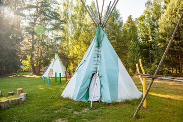 Dwelling tipi, The wigwam in the forest © Yauhen