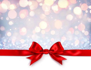 Fototapeta na wymiar Red Ribbon With Bow On Shiny Silver Background - Christmas Gift 