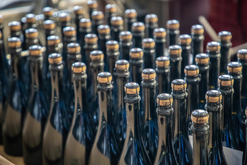 Fresh filled bottles of sparkling wine