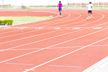 Fototapeta premium Athletics people running on the track field