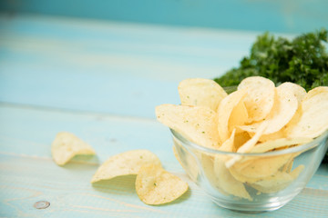 Potato chips with spicy in a glass bowl