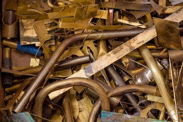 yellow metal from brass. remnants of brass processing after punching. Textural background. brass...