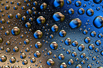 Colored Water Drops on a smooth glass surface
