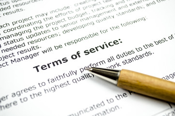 Terms of service with wooden pen