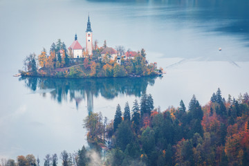 Naklejka premium Lake Bled is a lake in the Julian Alps of the Upper Carniolan region of northwestern Slovenia, where it adjoins the town of Bled. The area is a tourist destination.