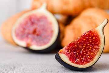 croissant and figs close-up on a white background.