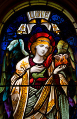 Fototapeta na wymiar HALIFAX, NOVA SCOTIA, CANADA- AUG 27, 2014: Detail from a selection of religious stained glass. Window found in St. Paul's Anglican Church, Halifax, Nova Scotia, Canada.