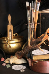 Antique Magic Book. Witchcraft Peacock feathers and candle background. Black candle Magic Ritual.