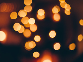 image of blurred bokeh background with warm colorful lights, vintage tone