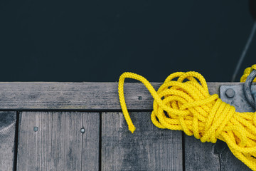 high angle view of yellow rope on boat dock