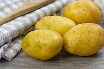 potatoes on wooden background