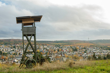 Wooden lookout tower for hunting in the woods and on meadow