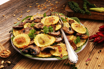Obraz na płótnie Canvas Ravioli with spinach or Pumpkin Tortellini with chard and mushrooms.