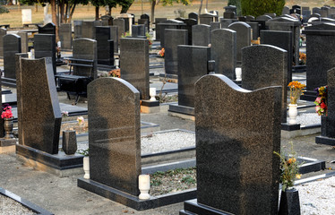 New cemetery alley with marble tombs in row