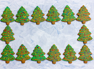 Christmas tree gingerbread - homemade christmas cookies with green icing and colorful sprinkles...