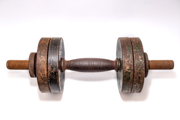 Old rusty dumbbell on a white background