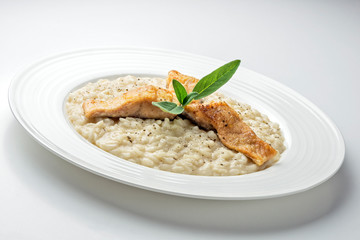 Dish of Parmesan risotto with fish fillet