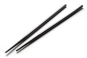 Black chopsticks on a white background
