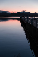 Lake and dock at sunset