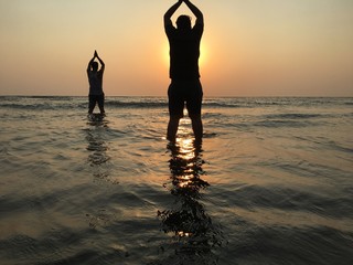 silhouette of a man on the beach at sunset