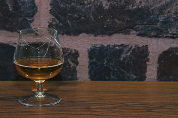 whiskey in a broken snifter