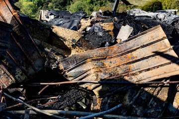 Burned damaged ruins of destroyed sprinkler fire protection system in supermarket. Arson investigation insurance