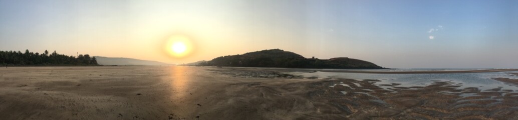 Panoramic view of sunset over the beach/sea coast