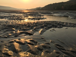 sunset on coast of sea