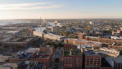 Obraz premium Milwaukee river in downtown, harbor districts of Milwaukee, Wisconsin, United States. Real estate, condos in downtown. Aerial view, drone flying