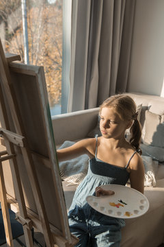 Girl painting at home