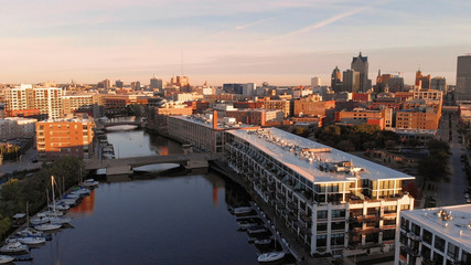 Milwaukee river in downtown, harbor districts of Milwaukee, Wisconsin, United States. Real estate, condos in downtown. Aerial view, drone flying