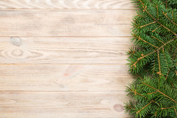 Christmas gray wooden background with fir tree and copy space. top view empty space for your design