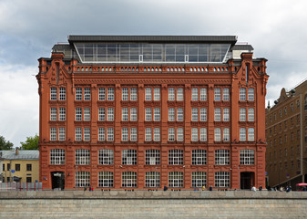 Red brick building on the embankment in Moscow