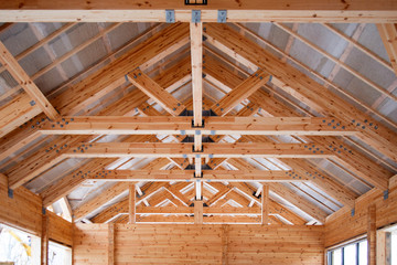 roof construction of big wooden trusses closeup - obrazy, fototapety, plakaty