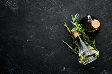 Oil and soy sauce on a black stone background. Top view. Free space for your text.