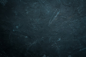 Black stone background. Black surface. Top view. Free space for your text.