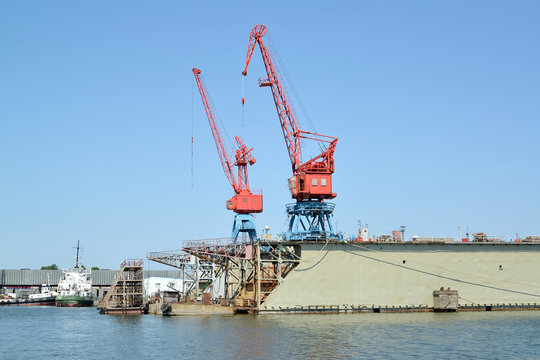  Fragment of ship dock with port cranes. City Svetlyj, Kaliningrad region