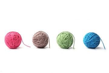 Set of colorful cotton thread balls from four color green, blue, pink, grey thread  isolated on...