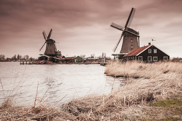 Wooden windmills on Zaan river coast