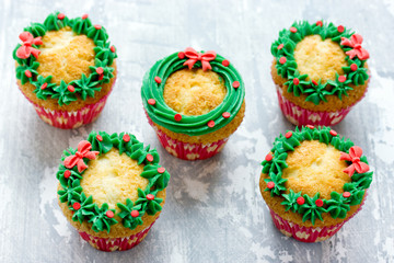 Christmas wreath cupcakes -  beautiful and delicious homemade cupcakes decorated with green cream and candy sprinkles, Christmas and New Year dessert