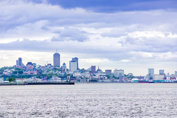 Panorama cityscape and skyline of Quebec City with Saint Lawrence river and boats during sunset