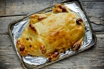 Mashed potato casserole shaped funny pig like a real. Festive dinner dish for Christmas, new year...
