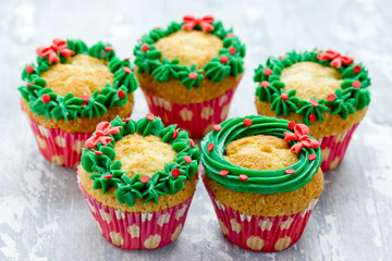 Christmas wreath cupcakes -  beautiful and delicious homemade cupcakes decorated with green cream and candy sprinkles, Christmas and New Year dessert