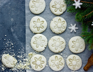 Christmas snowflake cookies, homemade round white biscuits with snowflake ornament