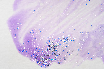 Stain watercolor paint on paper. glitter paint. light purple