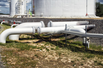 Naklejka premium Steel fuel pipes and valves at the oil refinery