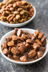 Meal for dog or cat. Canned meat with sauce.