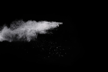 White powder isolated on black background.
