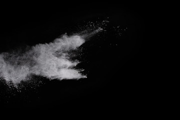 White powder isolated on black background.