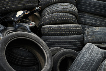 Pile of old tires, close-up. Damaged broken dirty